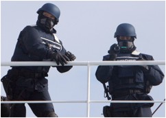 Japanese coast guards with flash grenades