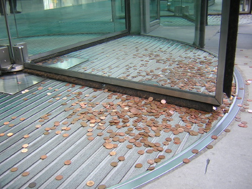 Caravan at RBS HQ with dumped pennies