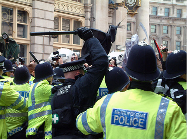 G20 police medic -cracking heads with baton