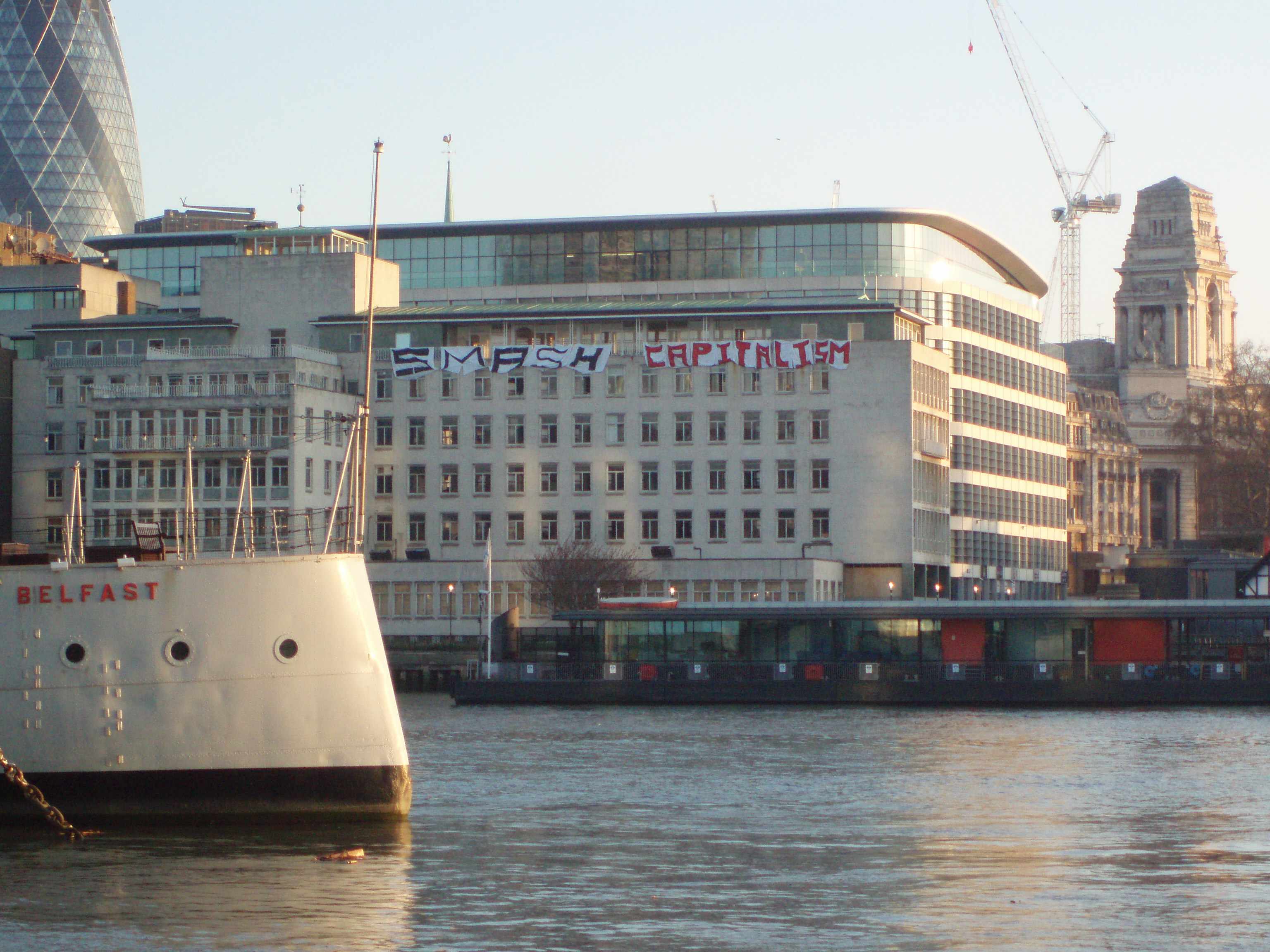 Smash Capitalism banner on the Thames