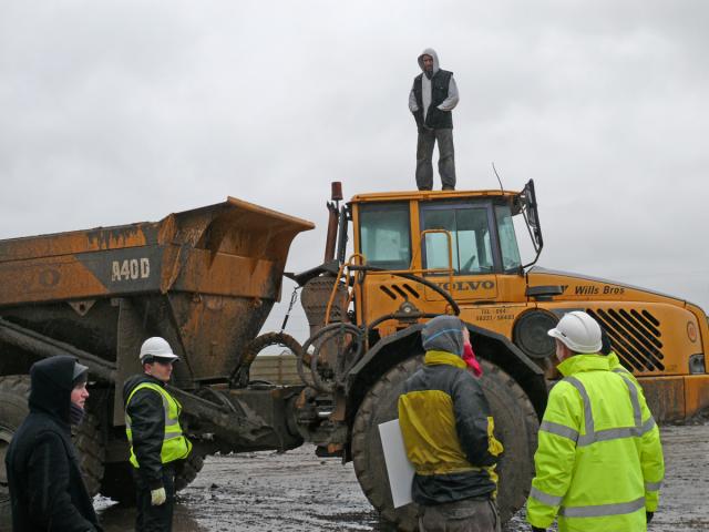 Standing on a dumper-truck at Tara