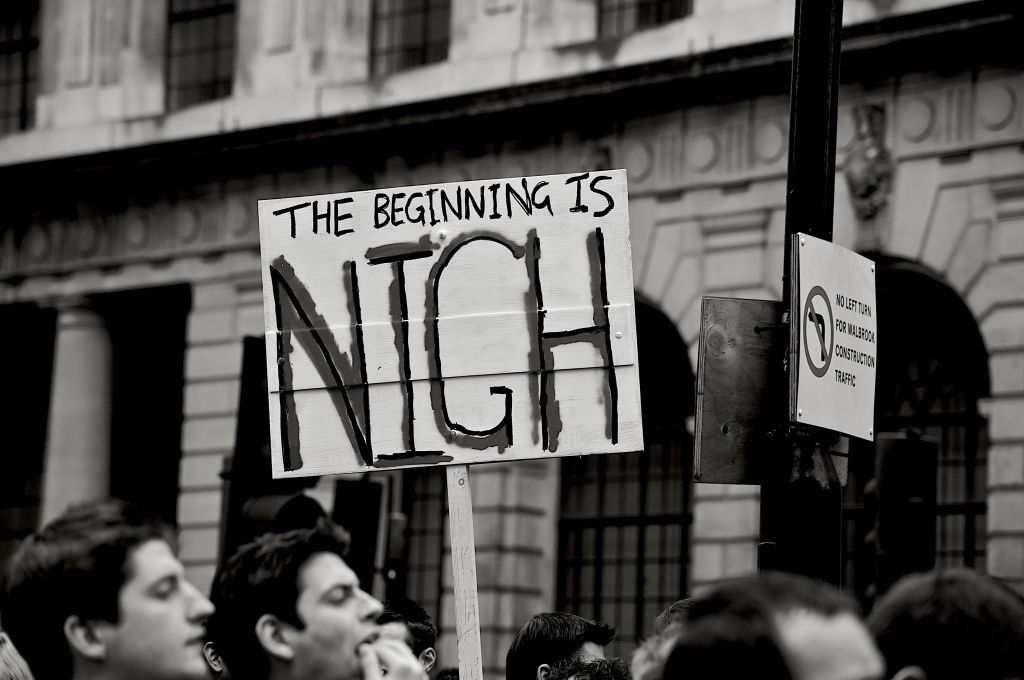 'The Beginning is Nigh' placard