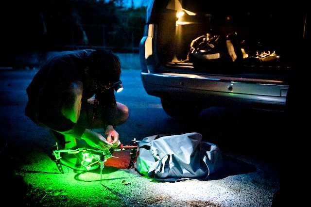 A member of the Black Fish toying around with a quadcopter supplied by ShadowView. Photo by Chris Grodotzki