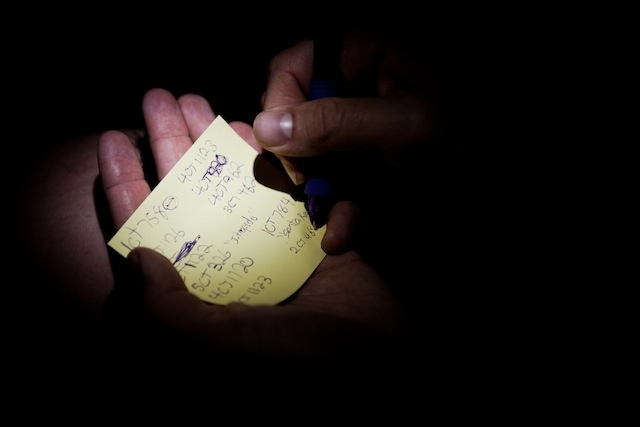 A Black Fish member logging the registration numbers of fishing boats that have been blacklisted by the EU. Photo by Chris Grodotzki