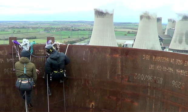 Activists occupy 300ft chimneys at the West Burton power station - video