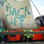 Frack Off banner at bus blockae