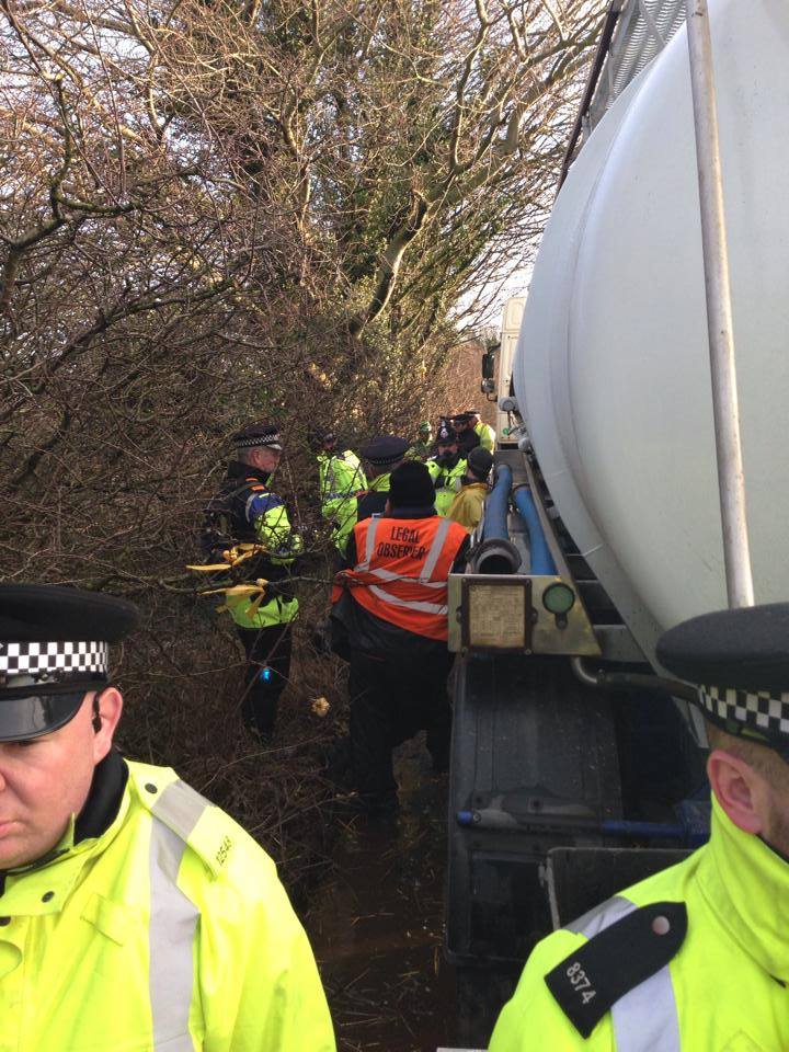 Man chained to lorry