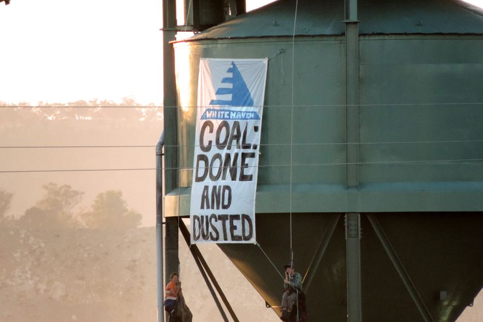 Two protesters scaled a coal loader and dropped a banner at Whitehaven's Werris Creek mine. (photo courtesy Leard Forest Alliance)