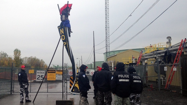 The third woman at the protest spent hours teetering on this makeshift construction before being removed by firefighters. (Kate McKenna/CBC)