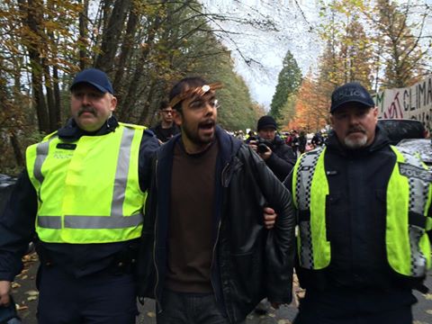 Adam Gold of the Heiltsuk First Nation being arrested