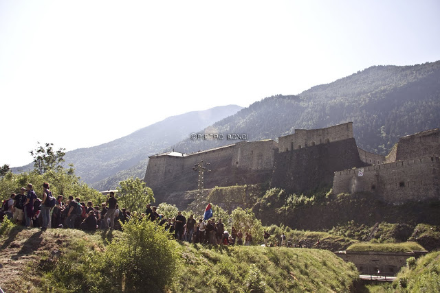 Diverse crowd of protestors marching from a historical site through the forest set to be destroyed by TAV / by Pietro Bondi